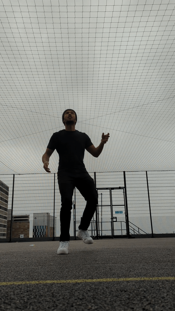 Doing kick-ups with a soccer ball